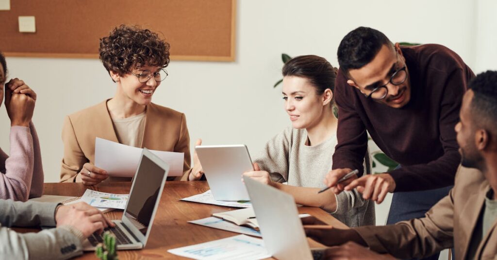 A diverse group of professionals engaged in a collaborative office meeting, sharing ideas and discussing projects.